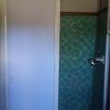New shower door in blue bathroom